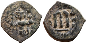 al-Malik ibn Marwan (687-705), Byzantine style folis Obverse: Imperial figure holding globe and cross Reverse: M and inscription