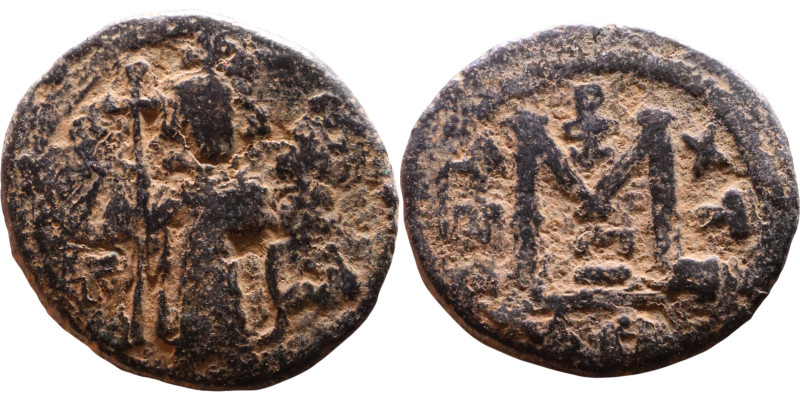 al-Malik ibn Marwan (687-705), Byzantine style folis Obverse: Imperial figure ho...