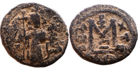 al-Malik ibn Marwan (687-705), Byzantine style folis Obverse: Imperial figure holding globe and cross Reverse: M and inscription