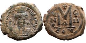 Maurice Tiberius (582-602) Follis. Obverse: Helmeted and cuirassed bust facing, holding globus cruciger and shield., Reverse: Large M above cross, ANN...