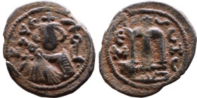 al-Malik ibn Marwan (687-705), Byzantine style folis Obverse: Imperial figure holding globe and cross Reverse: M and inscription