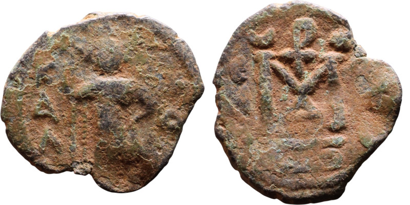 al-Malik ibn Marwan (687-705), Byzantine style folis Obverse: Imperial figure ho...