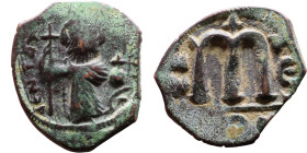Constans II (641-668) Follis. Obverse: Imperial figure holding cross and globus Reverse: m and inscription