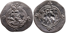Khosrow II (591-628) Drachm Obv: Bust of a king wearing a winged crown, turned to the right. Rev: Blazing altar of fire situated between two guards