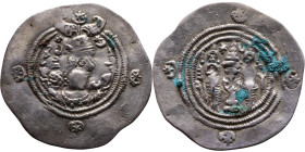Khosrow II (591-628) Drachm Obv: Bust of a king wearing a winged crown, turned to the right. Rev: Blazing altar of fire situated between two guards