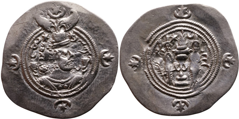 Khosrow II (591-628) Drachm Obv: Bust of a king wearing a winged crown, turned t...