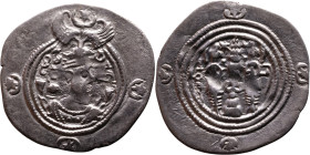 Khosrow II (591-628) Drachm Obv: Bust of a king wearing a winged crown, turned to the right. Rev: Blazing altar of fire situated between two guards