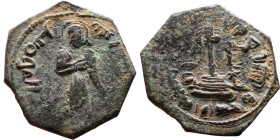 al-Malik ibn Marwan (687-705) Follis. Obverse: Standing caliph Reverse: Modified cross potent set on steps