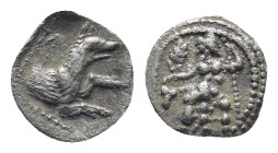 Lycaonia. Laranda 324-323 BC. Obol.AR (11mm, 0,53 g) Baaltars seated left, holding grain ear, grape bunch, and sceptre. Rev: Forepart of wolf right; i...
