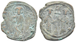 Constantine X Ducas and Eudocia AD 1059-1067. Constantinople Follis Æ (27mm, 8.8 g). +EMMANOVHΛ; Christ standing facing on footstool, wearing nimbus a...