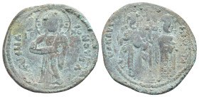 Constantine X Ducas and Eudocia AD 1059-1067. Constantinople Follis Æ (28mm, 7,4 g). +EMMANOVHΛ; Christ standing facing on footstool, wearing nimbus a...