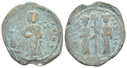 Constantine X Ducas and Eudocia AD 1059-1067. Constantinople Follis Æ (30mm, 6,4 g). +EMMANOVHΛ; Christ standing facing on footstool, wearing nimbus a...