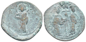 Constantine X Ducas and Eudocia AD 1059-1067. Constantinople Follis Æ (30mm, 7,1 g). +EMMANOVHΛ; Christ standing facing on footstool, wearing nimbus a...