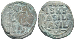 Anonymous (attributed to Constantine IX), circa AD 1050-1060. AE Follis (29mm, 13.9 g). Christ seated in throne, facing, wearing tunic and himation, r...