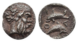 ISLANDS off THRACE. Thasos. Hemiobol (circa 412-404 BC)

Obv: Head of satyr right. 
Rev: ΘΑΣΙ. Two dolphins swimming in opposite directions. 

Le Ride...
