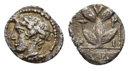 MACEDON. Chalkidian League. Olynthos. Trihemiobol (circa 400 BC).

Obv: Laureate head of Apollo to left; border of dots.
Rev: Τ-Ρ/Ι-Η Laurel branch wi...