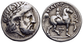 KINGS OF MACEDON. Philip II (359-336 BC). Tetradrachm. Pella.

Obv: Laureate head of Zeus right.
Rev: ΦΙΛΙΠΠOΥ.
Nude youth on horseback right, holding...