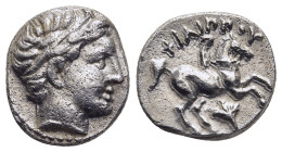 KINGS OF MACEDON. Philip II (359-336 BC). 1/5 Tetradrachm. Amphipolis.

Obv: Diademed head of Apollo right.
Rev: ΦΙΛΙΠΠΟΥ.
Youth on horse rearing righ...