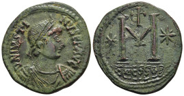 JUSTIN I (518-527). Follis. Thessalonica.

Obv: D N IVSTINVS P P AVG.
Diademed, draped and cuirassed bust right.
Rev: Large M between stars; above, cr...
