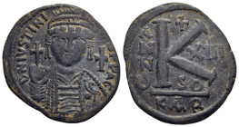 JUSTINIAN I (527-565). Half Follis. Carthage.

Obv: D N IVSTINIANVS P P AVG.
Helmeted and cuirassed bust facing, holding globus cruciger and shield; c...