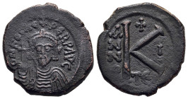 PHOCAS (602-610). Half Follis. Thessalonica.

Obv: d m FOCA PPAVG.
Crowned and draped bust facing, holding globus cruciger.
Rev: Large K; A/N/N/O ...