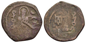 ISLAMIC. UMAYYADS. Standing Caliph types. AE Fals (AH 74-80). Harran (Carrhae).

Obv: Caliph standing facing; downwards to left, Muhammad in Kufic; do...