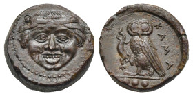 Sicily. Kamarina. Tetras or Trionkion. Circa 420-410 BC (Bronze, 14.91 mm, 3.78 g). Gorgoneion facing, protruding tongue. Rev. KAMA, Owl standing left...