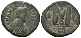 ANASTASIUS I.(491-518).Constantinople.40 Nummi.

Obv : D N ANASTASIVS P P AVG. Diademed, draped and cuirassed bust right.
Rev : Large M; star to left ...