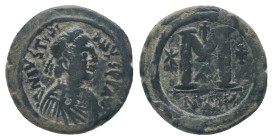JUSTIN I (518 - 527 AD). Ae. Follis. Nicomedia

Obv: DN IVSTINVS PP AVG, pearl diademed, draped, cuirassed bust right
Rev: Large M, star to left, c...