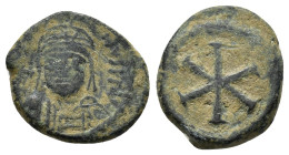 REATTRIBUTED FROM JUSTINIAN TO JUSTIN II. Justin II, AE Nummus, Carthage. ////////////////////

Obv : Helmeted, cuirassed bust facing.
Rev : No legend...