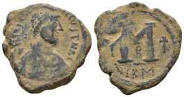 JUSTIN I & JUSTINIAN I. (527-565 AD). Ae. Follis. Nicomedia. 

Obv : Diademed, draped and cuirassed bust of Justin right.
Rev : Large M; star to left,...
