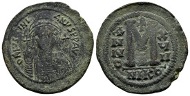 JUSTINIAN I (527-565). Ae. Follis. Nicomedia. Dated RY 17 (543/4).

Obv: D N IVSTINIANVS P P AVG.
Helmeted and cuirassed bust facing, holding globus c...
