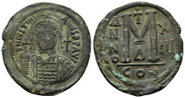 JUSTINIAN I (527-565 AD). Ae. Follis. Constantinople.

Obv: D N IVSTINIANVS P P AVG.
Frontal bust of Justinian I with plumed helmet, diadem, and cuira...
