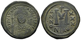 JUSTINIAN I, (527-565 AD). Ae. Follis. Nicomedia

Obv: D N IVSTINIANVS P P AVG, diademed, helmeted, and cuirassed facing bust, holding globus crucig...