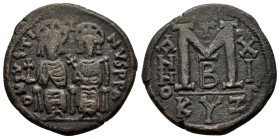 JUSTIN II (565-578 AD). Ae. Follis. Kyzikos.

Obv: D N IVSTINVS P P AVC.
Justin, holding globus cruciger, and Sophia, holding cruciform sceptre, seate...