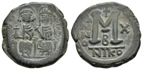JUSTIN II and SOPHIA.(565-578 AD). Ae. Follis. Cyzicus.

Obv : D N IVSTI NVS PP AV.
Justin and his wife Sophia, both nimbate, seated facing on throne:...