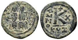 JUSTIN II and SOPHIA.(565-578 AD). Ae. Half Follis.

Obv : D N IVSTINVS P P AVG.
Justin and Sophia seated facing on double throne, holding globus cruc...