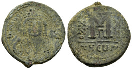 MAURICE TIBERIUS.(582-602 AD). Ae. Follis. Antioch.

Obv : D N MAURI C N P AVT.
Crowned facing bust, wearing consular robes, holding mappa and eagle-t...