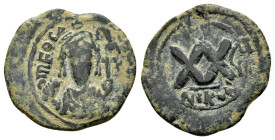PHOCAS (602-610 AD). Ae. Half Follis. Nicomedia. Uncertain RY date.

Obv: Crowned facing bust, wearing consular robes and holding mappa and cross.
Rev...