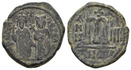 PHOCAS with LEONTIA (602-610 AD). Ae. Follis. Theoupolis (Antioch). 

Obv : D N FOCA NЄ PЄ AV.
Phocas, holding globus cruciger, and Leontia, holding c...