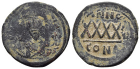 PHOCAS. (602-610 AD). Ae. Follis. Constantinople 

Obv : DM FOCAE PP AVG, crowned, mantled bust facing, holding mappa and cross.
Rev : Large XXXX, ANN...