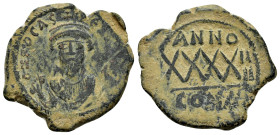 PHOCAS. (602-610 AD). Ae. Follis. Constantinople.

Obv : D N FOCAS PERP AVG.
Crowned bust facing, holding mappa and cross-tipped sceptre.
Rev : ANNO X...