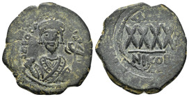 PHOCAS. (602-610 AD). Ae. Follis. Nicomedia.

Obv : δ m FOCA PER [AVς.
Crowned bust of Phocas facing, wearing consular robes, holding mappa in his ...