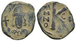 CONSTANTINE IV POGONATUS (668-685). Half Follis. Constantinople.

Obv: Helmeted and cuirassed bust facing, holding spear.
Rev: Large K; A/N/N/O - C/O/...