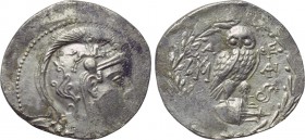 ATTICA. Athens. Tetradrachm (139/8 BC). New Style Coinage. 

Obv: Helmeted head of Athena right.
Rev: A - ΘE. 
Owl standing right on amphora, head...