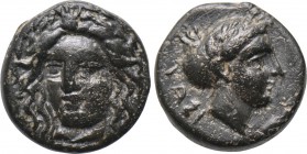 CARIA. Iasos. Ae (Circa 4th-3rd centuries BC). 

Obv: Laureate head of Apollo facing slightly left.
Rev: IAΣI. 
Head of nymph right, with hair in ...