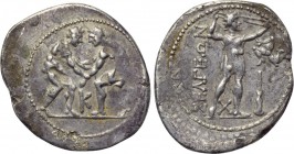 PISIDIA. Selge. Stater (Circa 325-250 BC). 

Obv: Two wrestlers grappling; K between.
Rev: ΣΕΛΓΕΩΝ. 
Slinger standing right; to right, triskeles a...