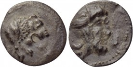 CILICIA. Uncertain. Obol (4th century BC). 

Obv: Forepart of lion right.
Rev: Head of satrap right, wearing bashlyk.

Göktürk -; Troxell & Kagan...
