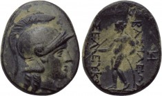 SELEUKID KINGDOM. Seleukos II Kallinikos (246-225 BC). Ae. Sardes. 

Obv: Helmeted head of Athena right.
Rev: ΒΑΣΙΛΕΩΣ / ΣΕΛΕΥΚΟΥ. 
Apollo standin...