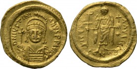 JUSTINIAN I (527-565). GOLD Solidus. Constantinople. 

Obv: D N IVSTINIANVS P P AVG. 
Helmeted and cuirassed bust facing, holding globus cruciger a...